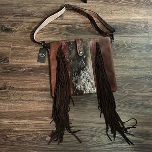 Myra Bag. Brand new never used. Still has tags on it. Smoke-free pet free home.